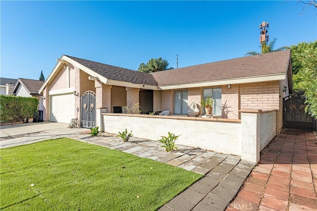 single story home with a garage and a front lawn