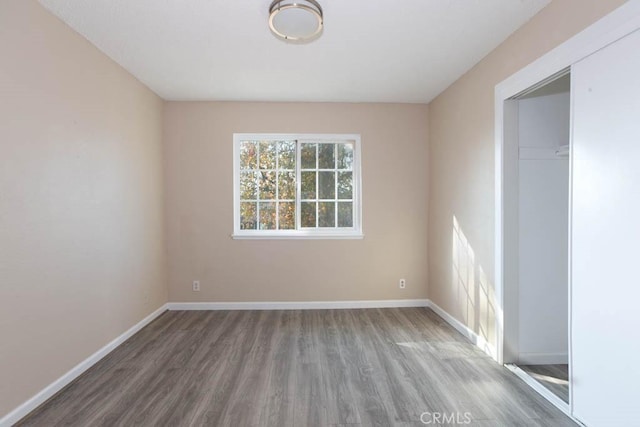 unfurnished room featuring hardwood / wood-style floors