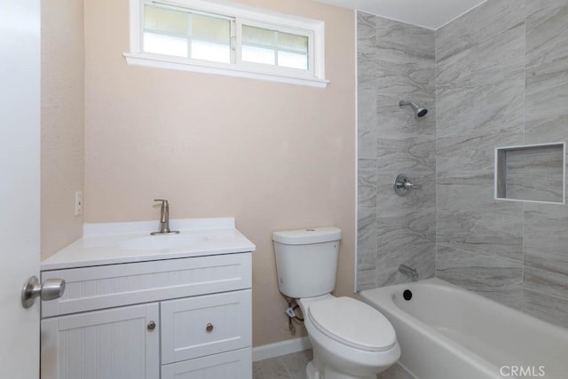 full bathroom featuring vanity, toilet, and tiled shower / bath combo