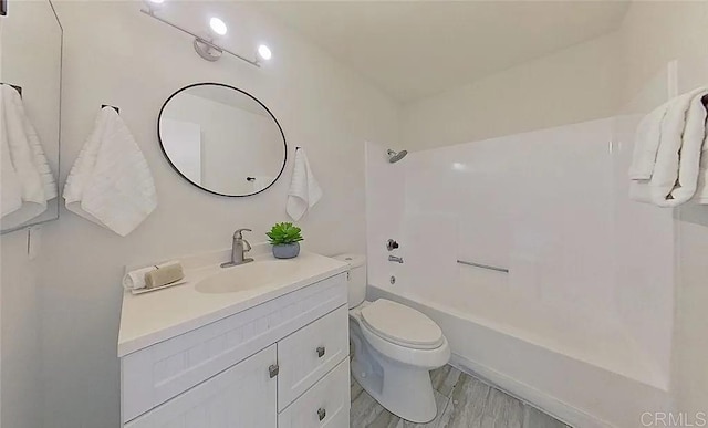 full bathroom with vanity,  shower combination, and toilet