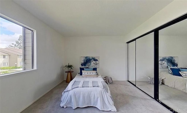 carpeted bedroom with a closet