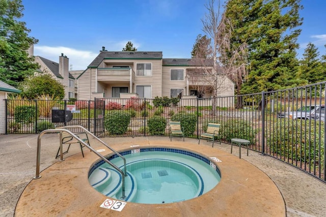 view of pool featuring a hot tub