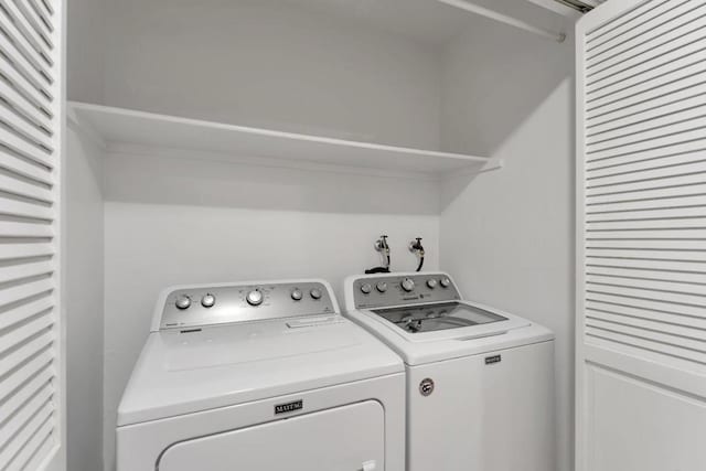 laundry room featuring washing machine and clothes dryer