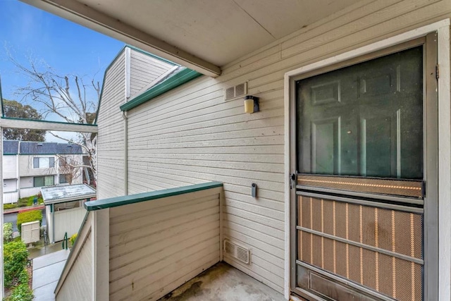 entrance to property with a balcony