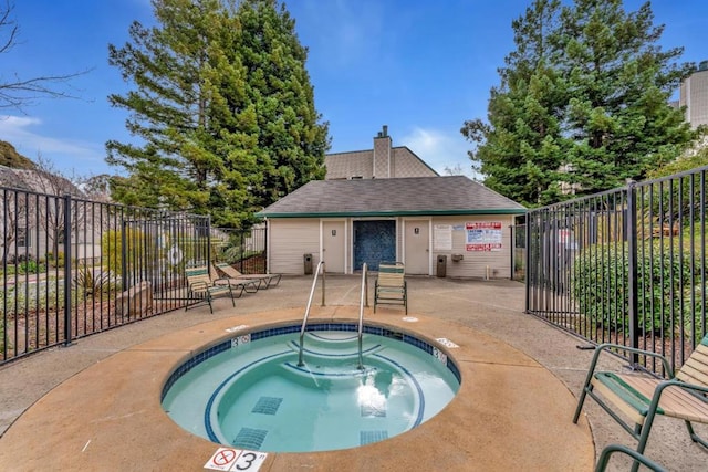 view of swimming pool with a community hot tub