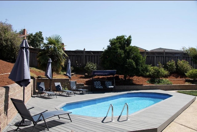 view of pool featuring a wooden deck