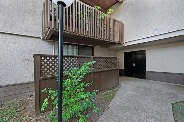 view of side of property with a balcony