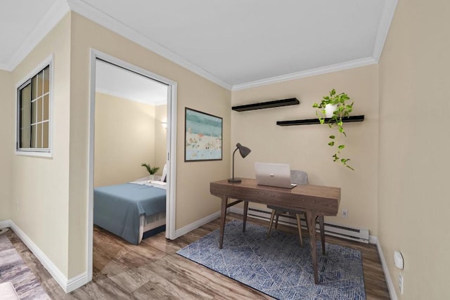 home office featuring hardwood / wood-style flooring, crown molding, and a baseboard heating unit