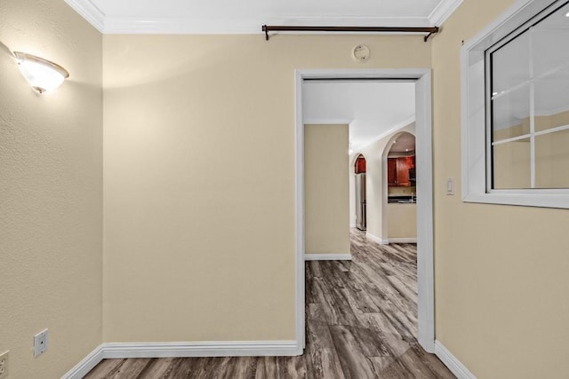 hall featuring crown molding and wood-type flooring