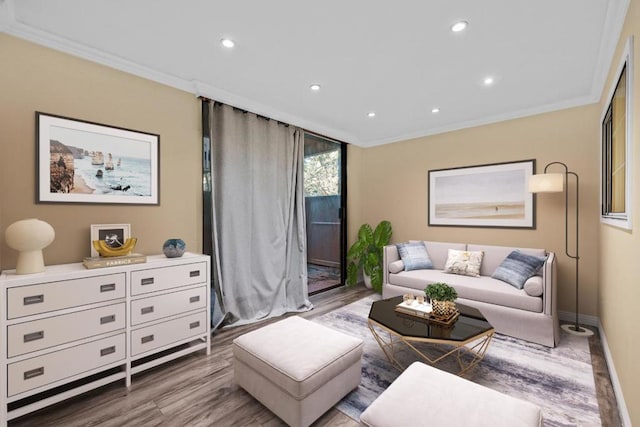 living room featuring crown molding and hardwood / wood-style flooring