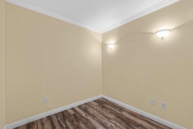 unfurnished room featuring wood-type flooring and ornamental molding