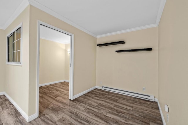 empty room with a baseboard radiator, ornamental molding, and wood-type flooring