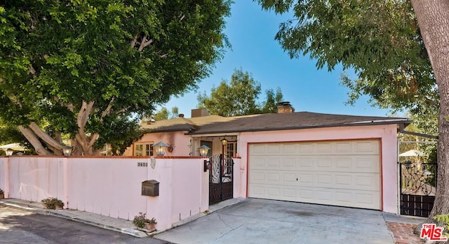 ranch-style home featuring a garage