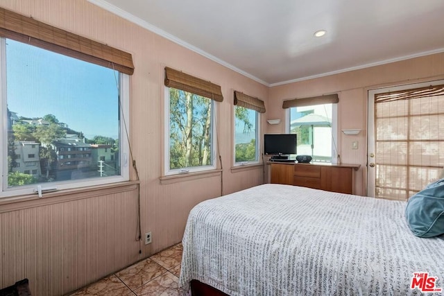 bedroom featuring light tile patterned floors and ornamental molding