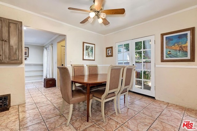 dining room with french doors, ceiling fan, and ornamental molding