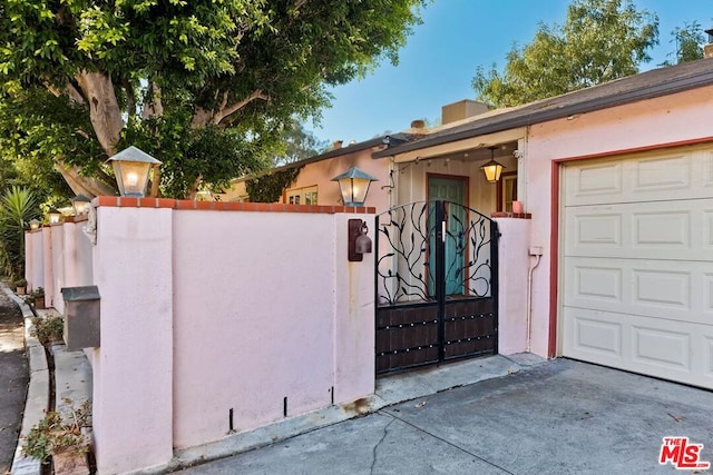 view of gate featuring a garage