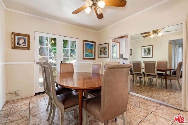 dining space with ornamental molding, ceiling fan, and french doors