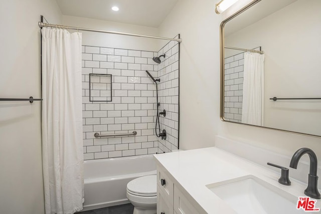 full bathroom with shower / bathtub combination with curtain, vanity, and toilet