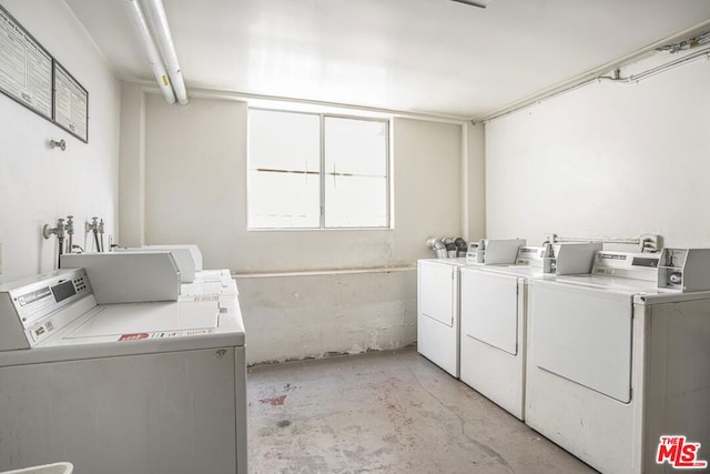 washroom with washing machine and clothes dryer