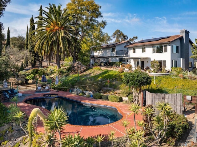 view of swimming pool featuring a patio area