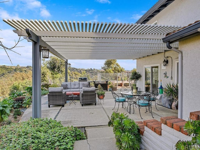 view of patio / terrace with an outdoor hangout area and a pergola