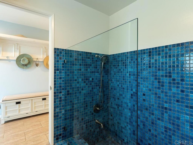 bathroom with tiled shower