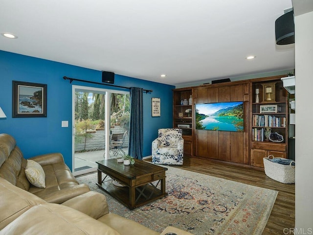 living room with dark hardwood / wood-style flooring