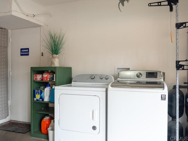 clothes washing area featuring washing machine and dryer