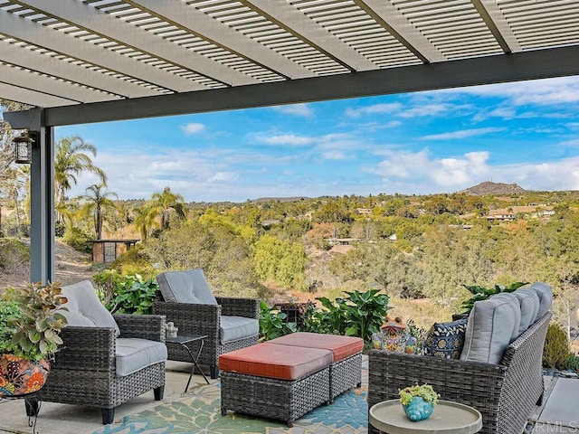 view of patio featuring outdoor lounge area and a pergola