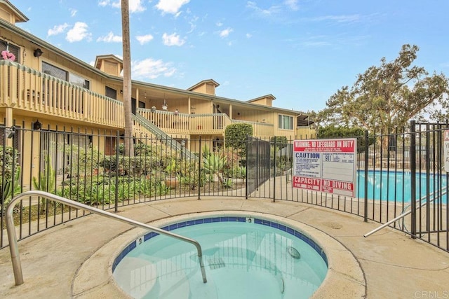 view of pool featuring a community hot tub