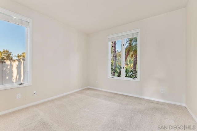 empty room with light colored carpet