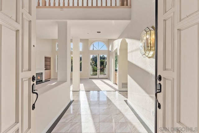 entryway with a towering ceiling