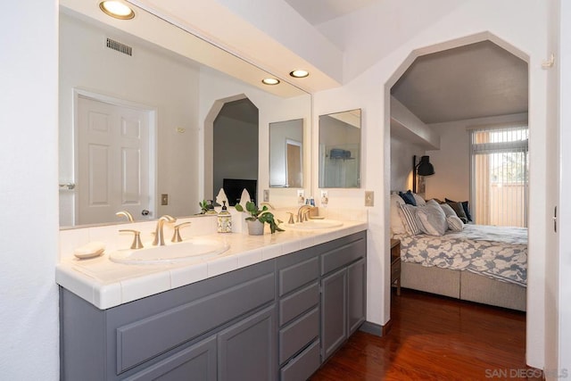 bathroom featuring vanity and hardwood / wood-style floors