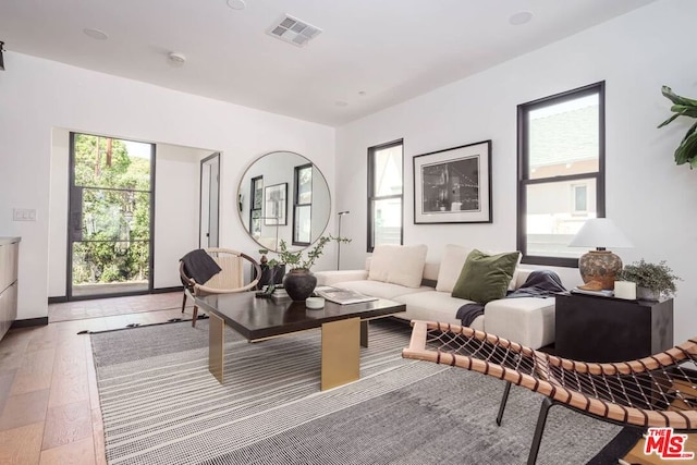 sitting room featuring hardwood / wood-style floors