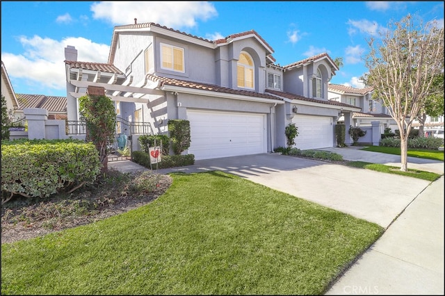 view of front of property featuring a garage and a front yard