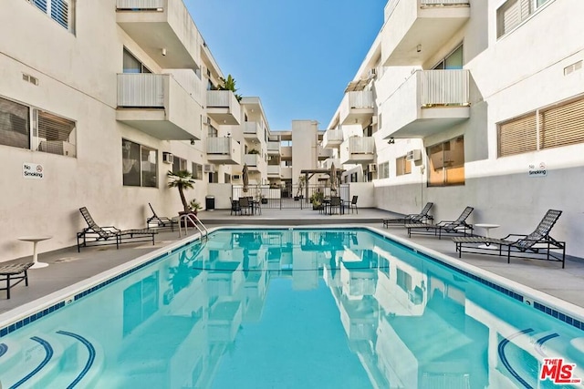 view of swimming pool featuring a patio