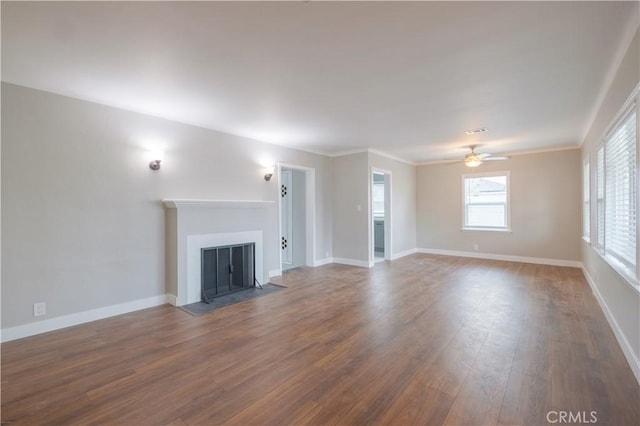 unfurnished living room with wood-type flooring and ceiling fan