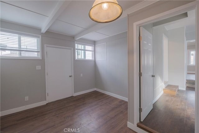 entrance foyer featuring dark hardwood / wood-style floors and beamed ceiling