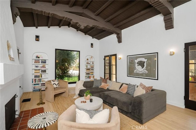 living room featuring hardwood / wood-style flooring, beam ceiling, high vaulted ceiling, and wooden ceiling