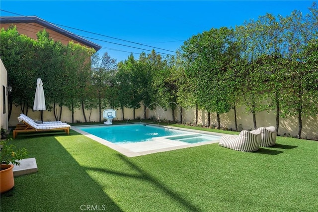 view of pool featuring a yard