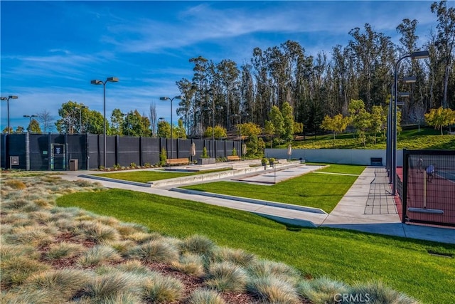 view of property's community featuring a yard