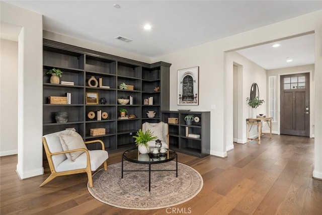 living area featuring hardwood / wood-style floors