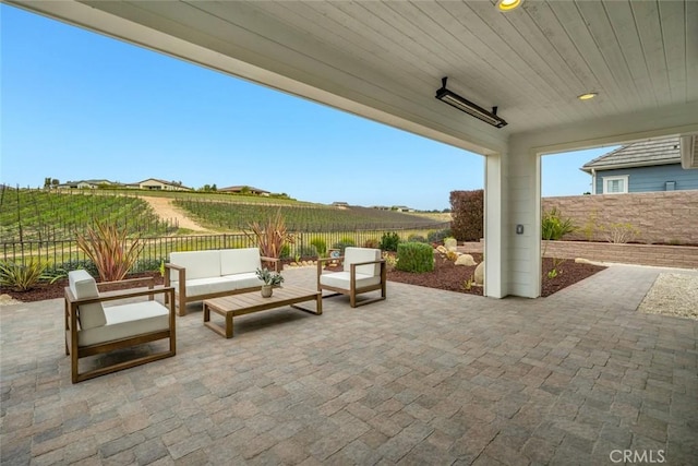 view of patio featuring a rural view and an outdoor hangout area