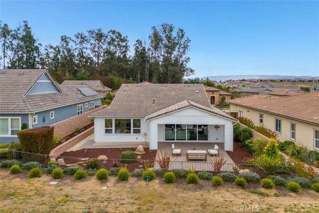 rear view of property with a patio