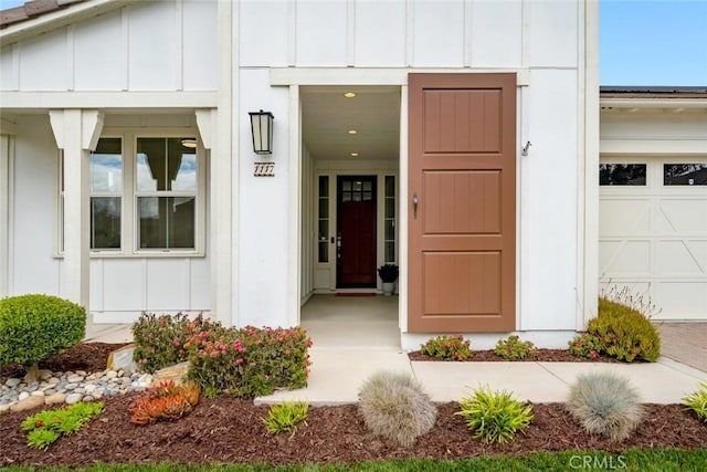 doorway to property featuring a garage