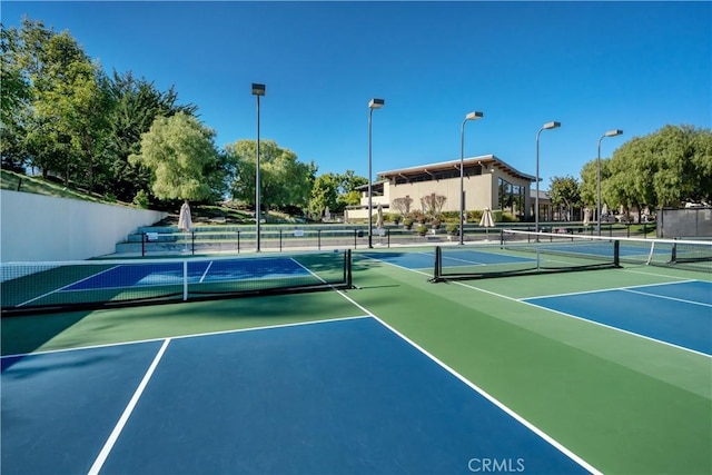 view of sport court featuring basketball hoop