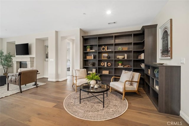 living area featuring hardwood / wood-style floors