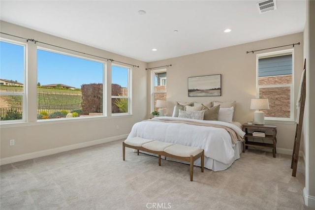 bedroom with light colored carpet