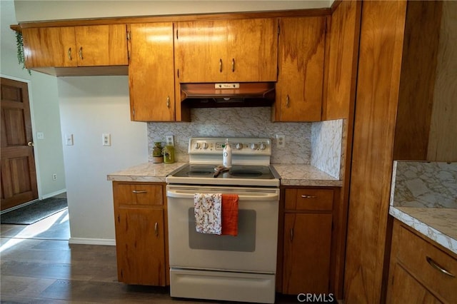 kitchen featuring tasteful backsplash, white electric range, and dark wood-type flooring