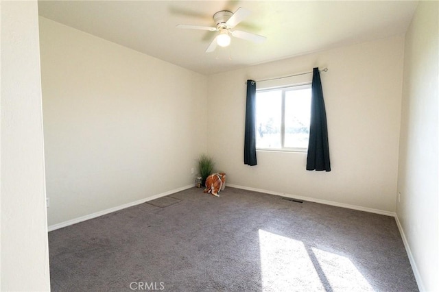 empty room with ceiling fan and carpet